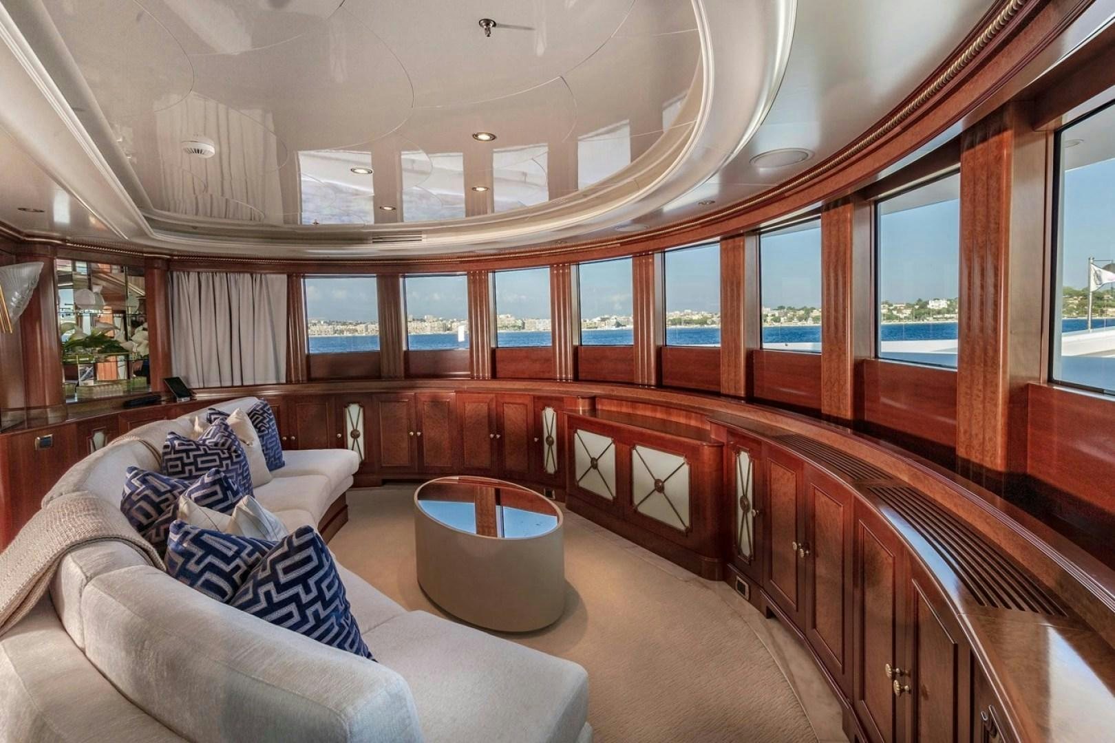 a room with a couch and a table aboard NEXT CHAPTER Yacht for Sale