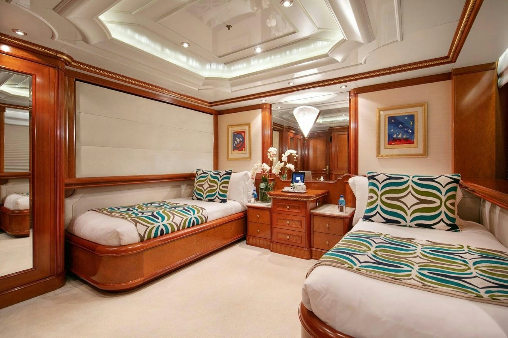 a bedroom with two beds aboard NEXT CHAPTER Yacht for Sale