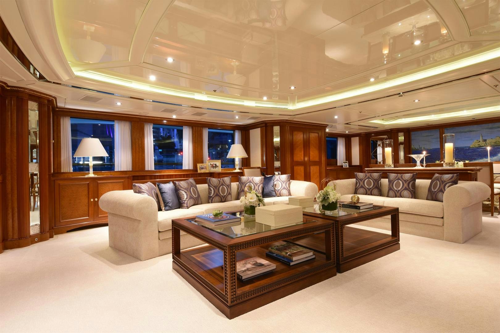 a living room with a large sofa aboard NEXT CHAPTER Yacht for Sale