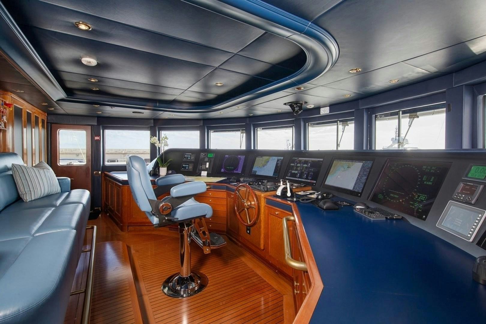 inside of a vehicle with a desk and chairs and a computer on the floor aboard NEXT CHAPTER Yacht for Sale