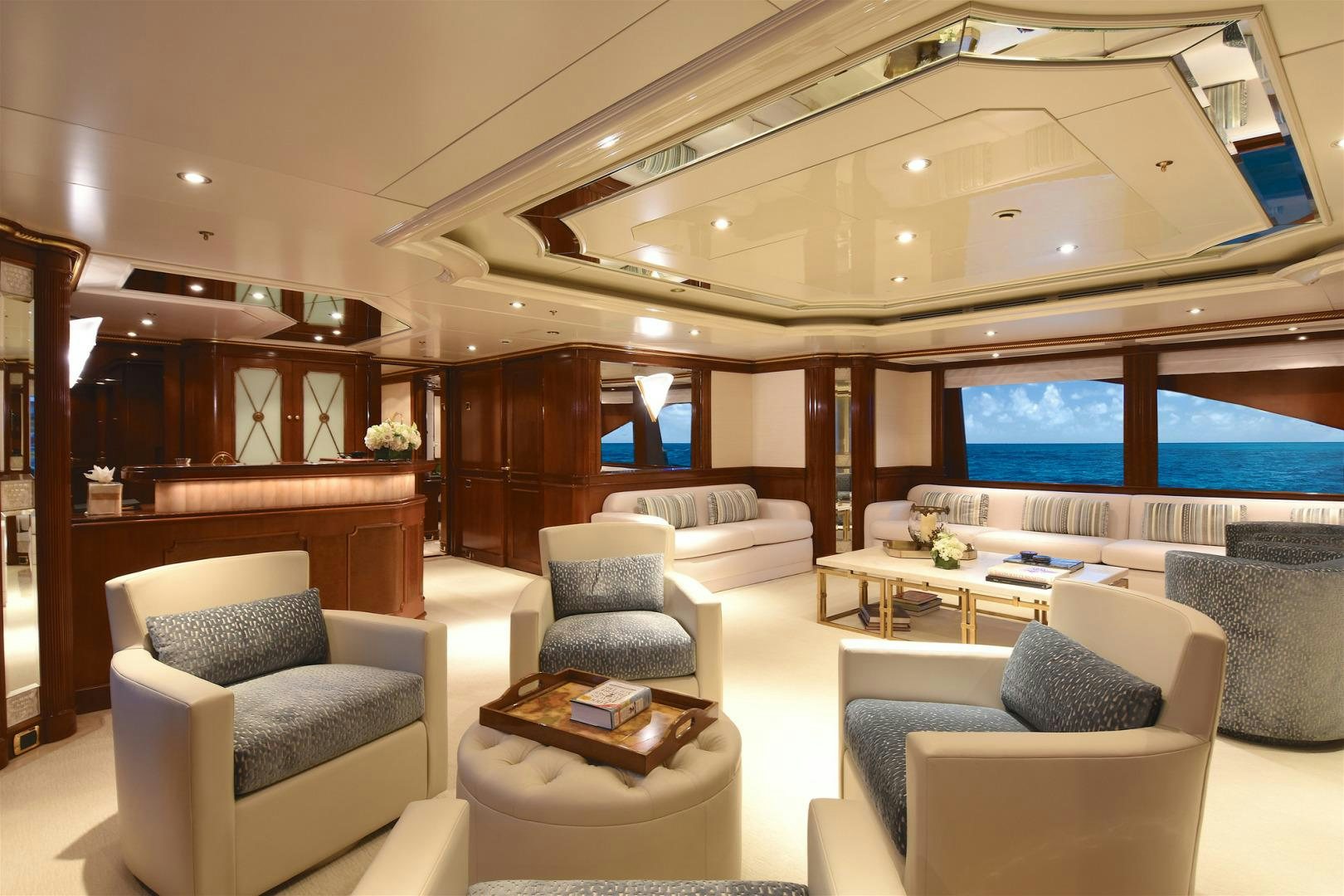 a room with a couch and a table and a tv aboard NEXT CHAPTER Yacht for Sale