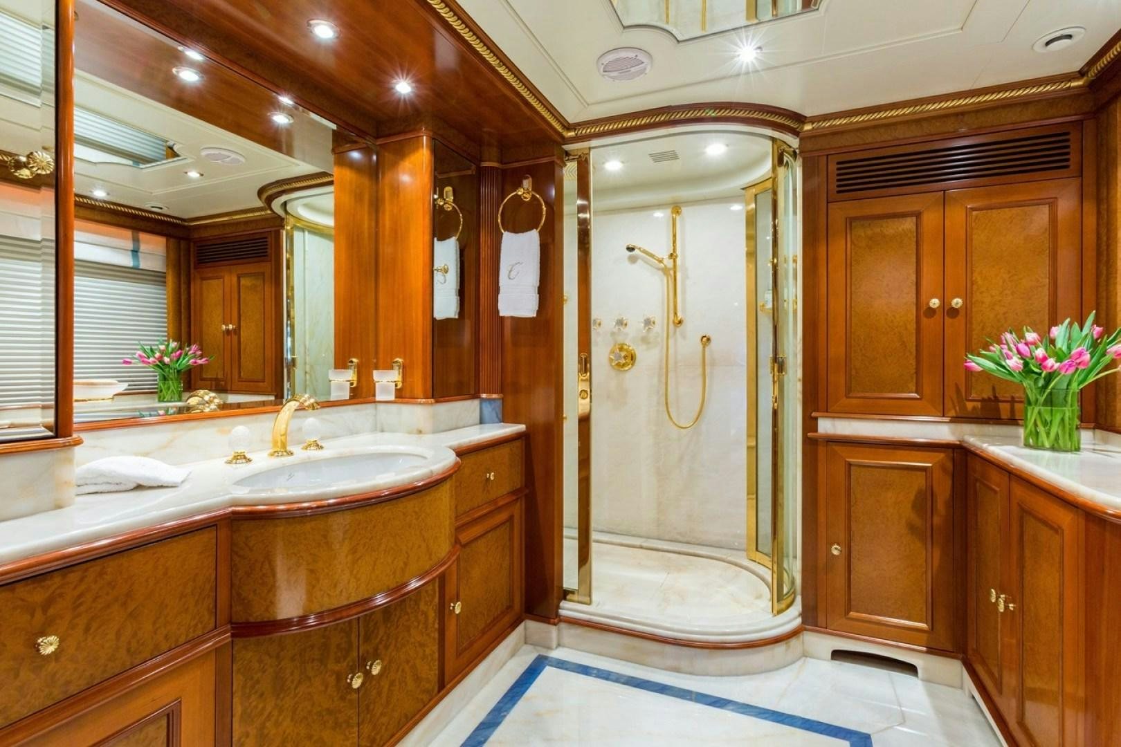a bathroom with a large mirror aboard NEXT CHAPTER Yacht for Sale