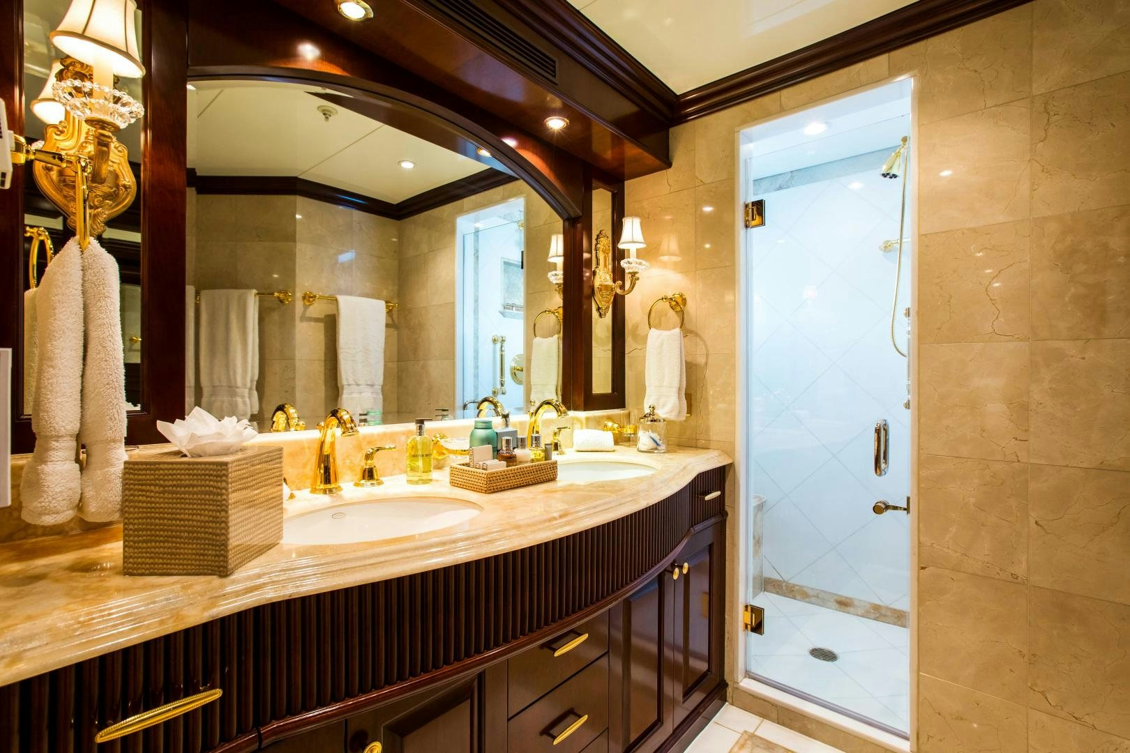 a bathroom with a large mirror aboard MUSTIQUE Yacht for Sale