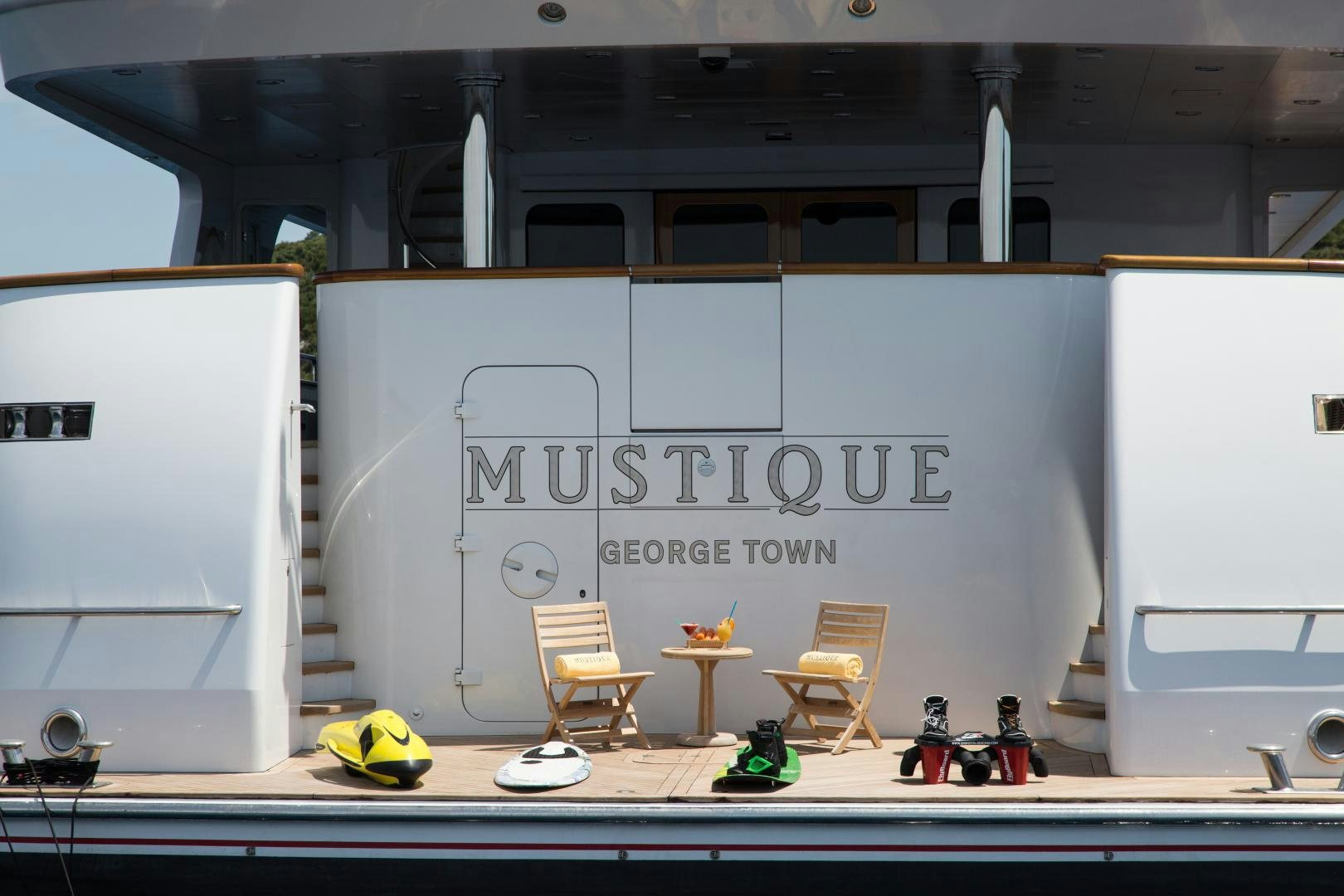 a room with a desk and chairs aboard MUSTIQUE Yacht for Sale