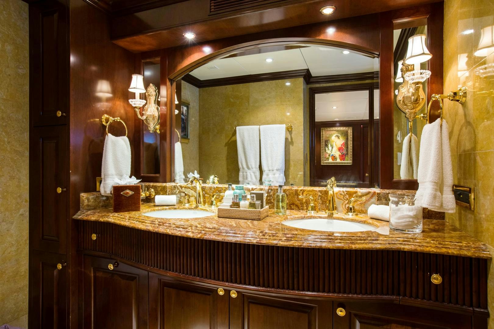 a bathroom with a large mirror aboard MUSTIQUE Yacht for Sale