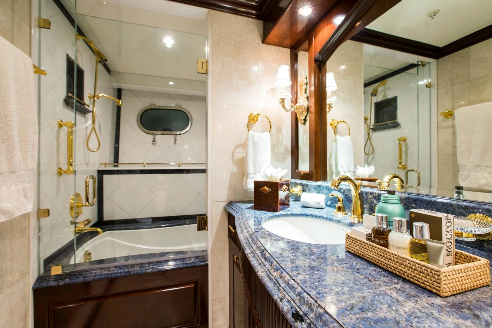 a bathroom with a large mirror aboard MUSTIQUE Yacht for Sale