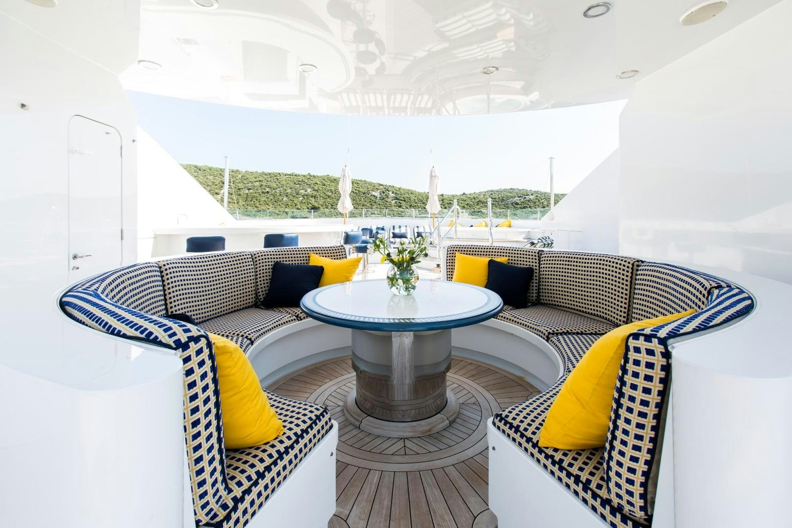a room with a table and chairs aboard MUSTIQUE Yacht for Sale