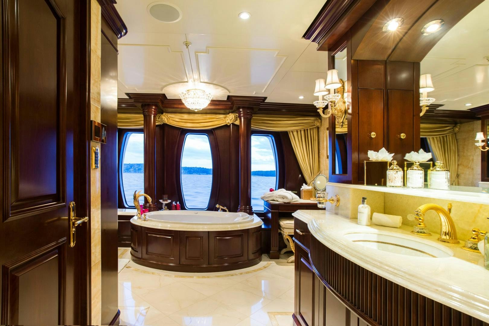 a bathroom with a large mirror aboard MUSTIQUE Yacht for Sale