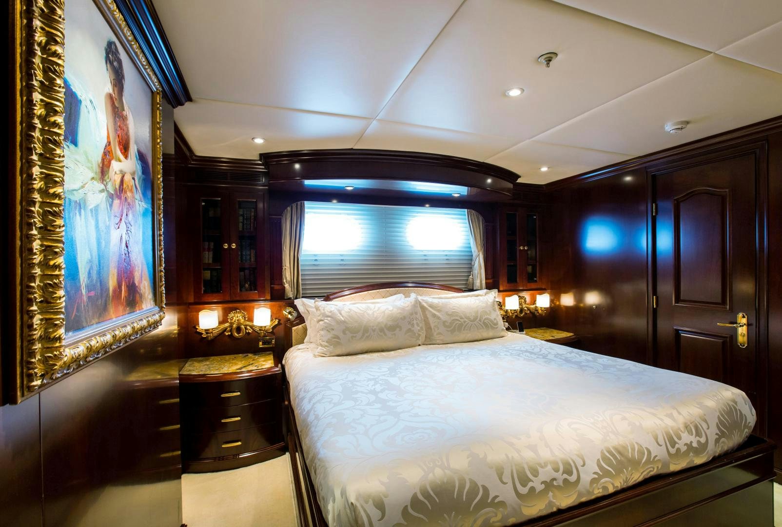 a bedroom with a large bed aboard MUSTIQUE Yacht for Sale
