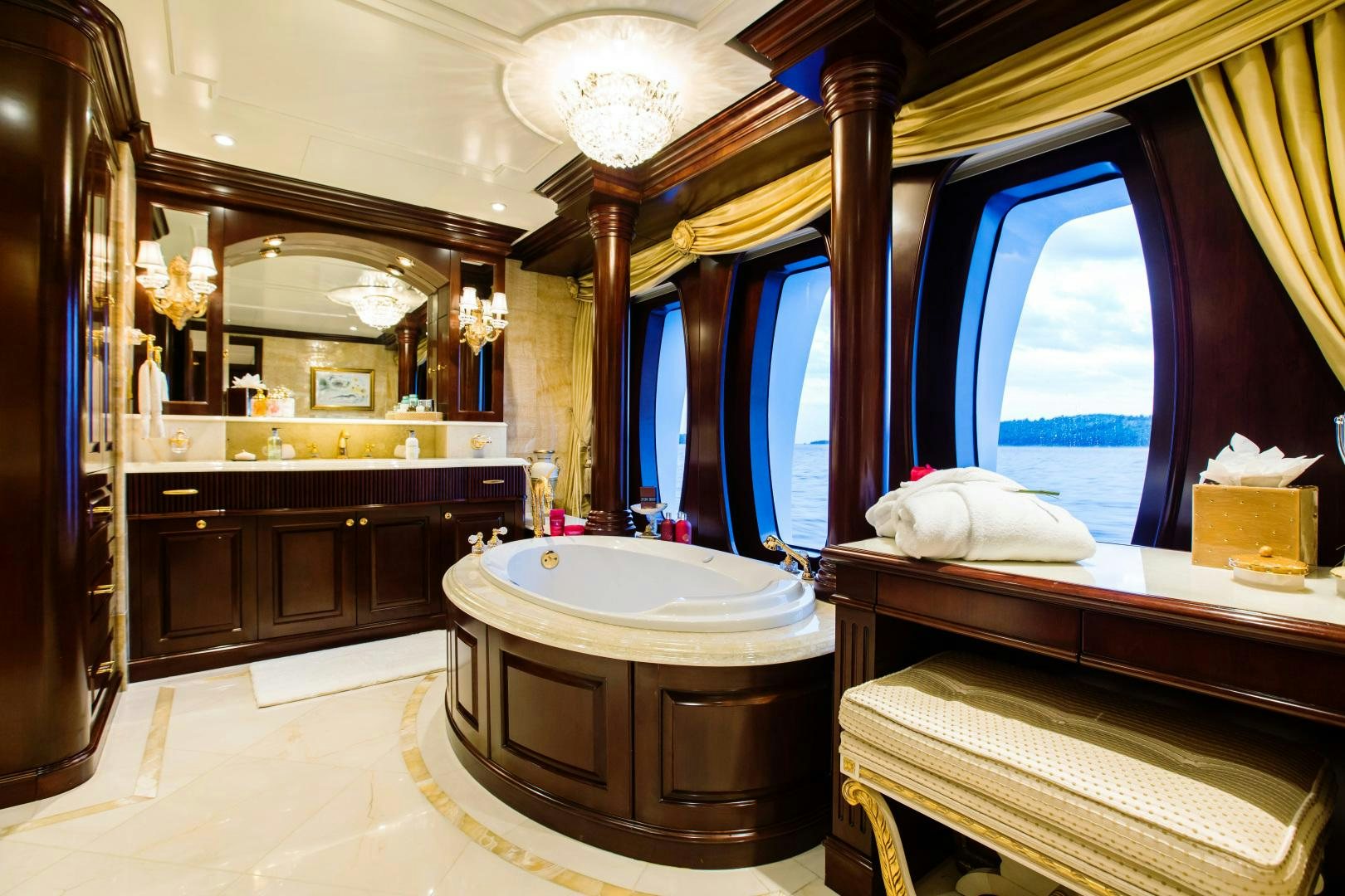 a bathroom with a large mirror aboard MUSTIQUE Yacht for Sale