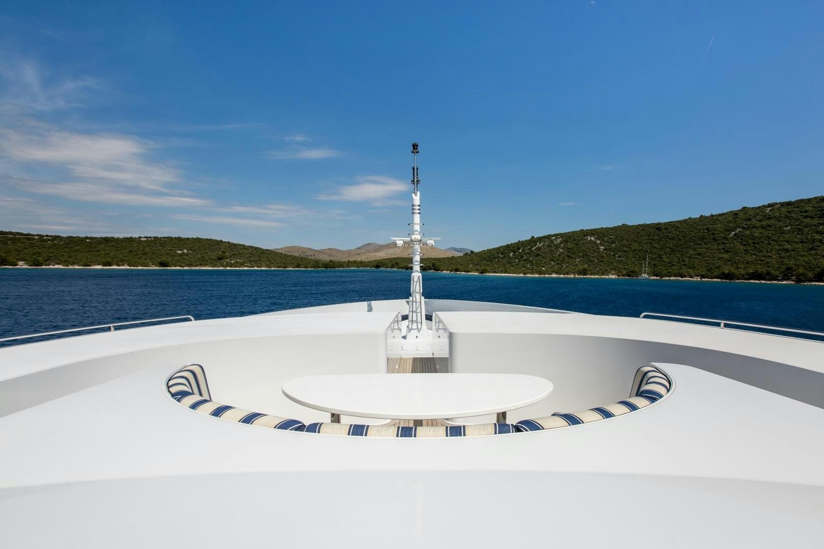 a boat on the water aboard MUSTIQUE Yacht for Sale