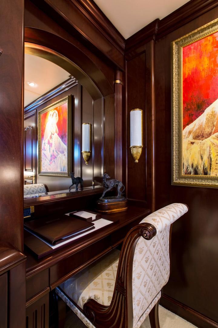 a room with a piano and a painting on the wall aboard MUSTIQUE Yacht for Sale