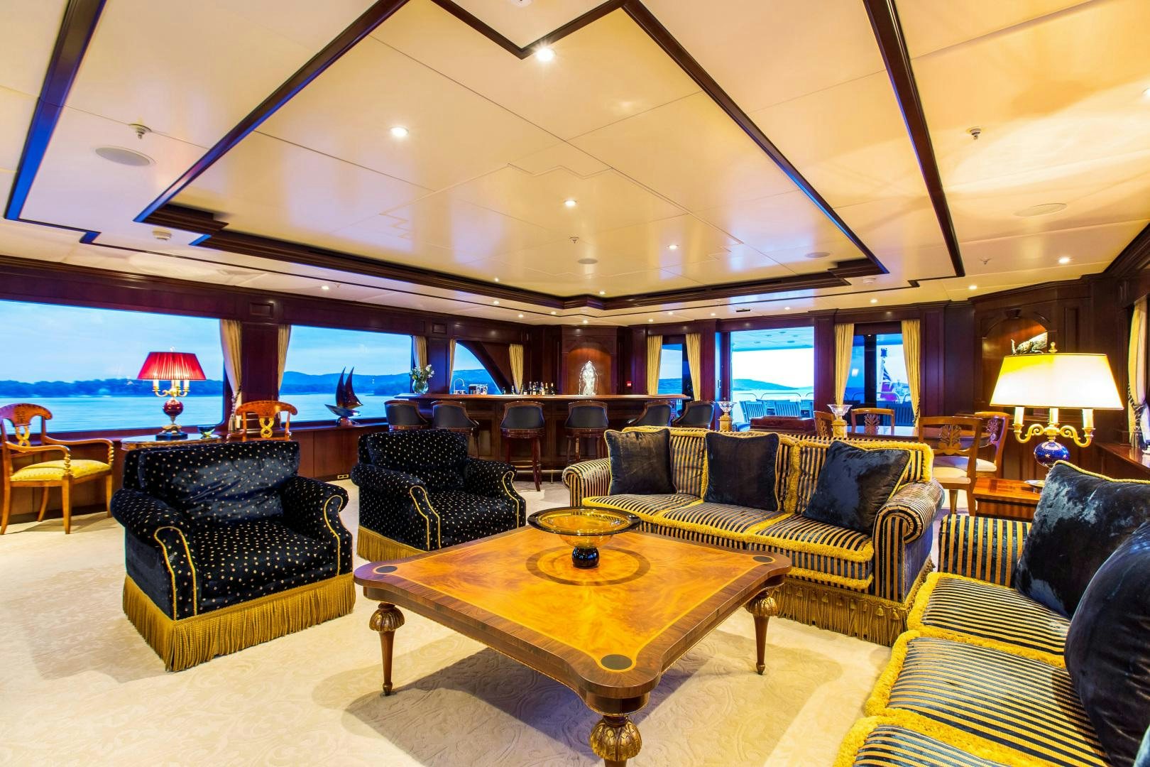 a living room with a large window aboard MUSTIQUE Yacht for Sale