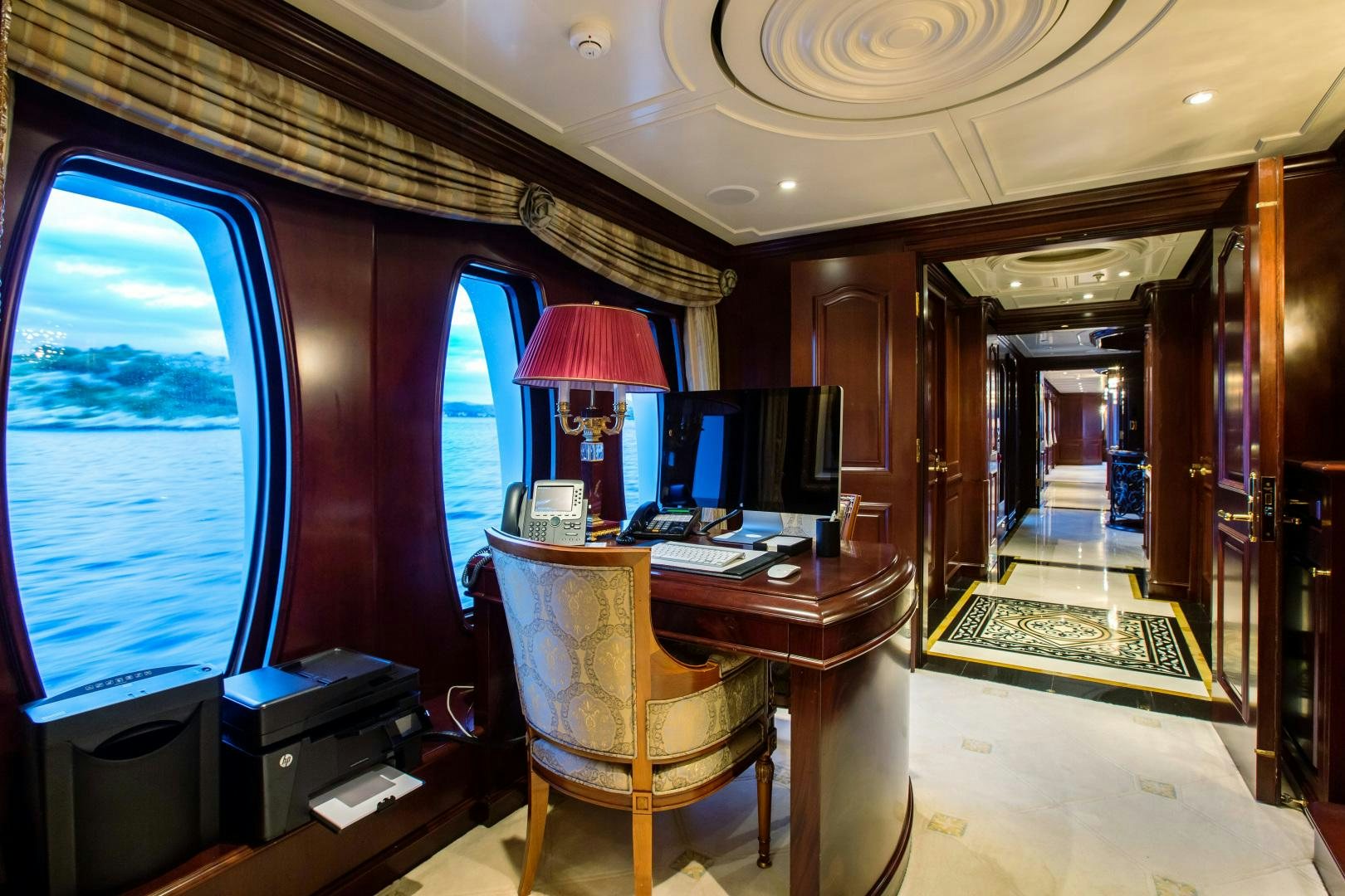 a room with a desk and computer aboard MUSTIQUE Yacht for Sale