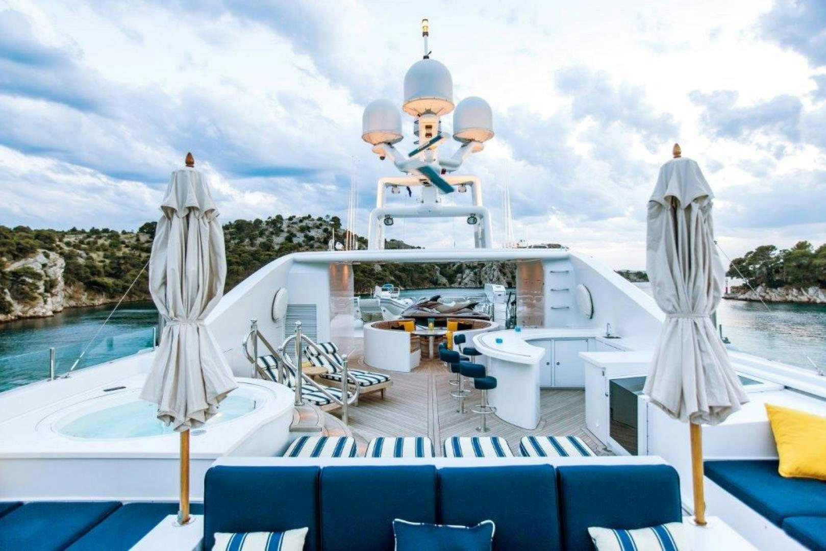 a boat on the water aboard MUSTIQUE Yacht for Sale