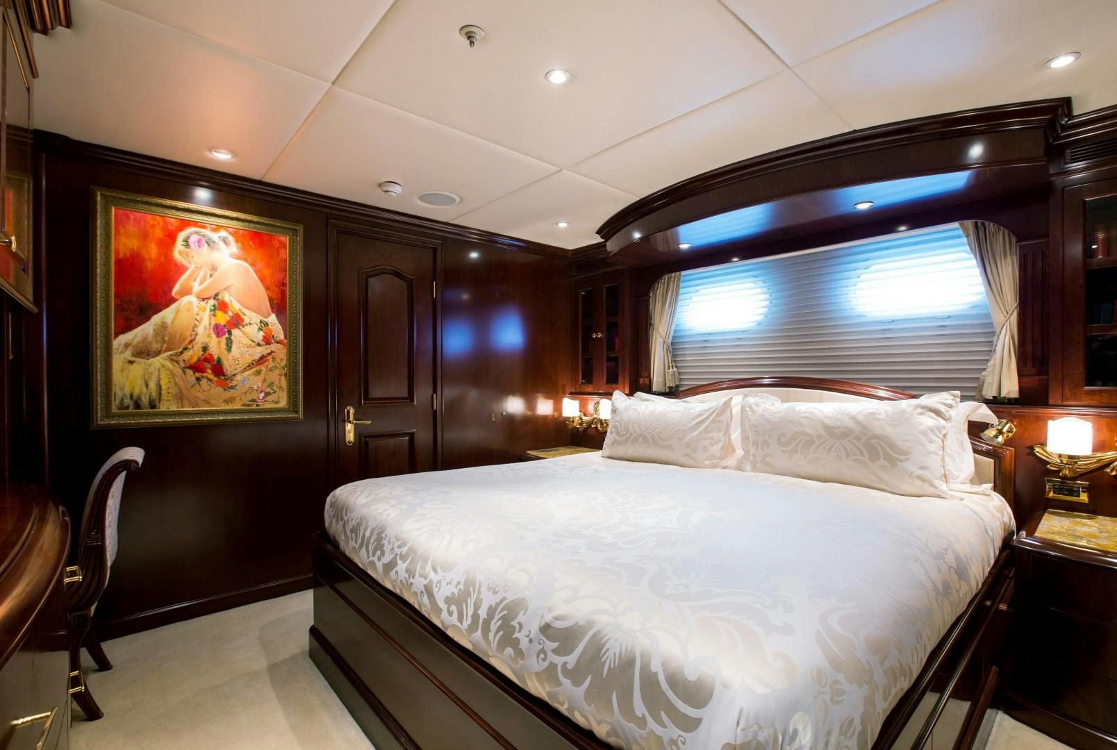 a bedroom with a large bed aboard MUSTIQUE Yacht for Sale