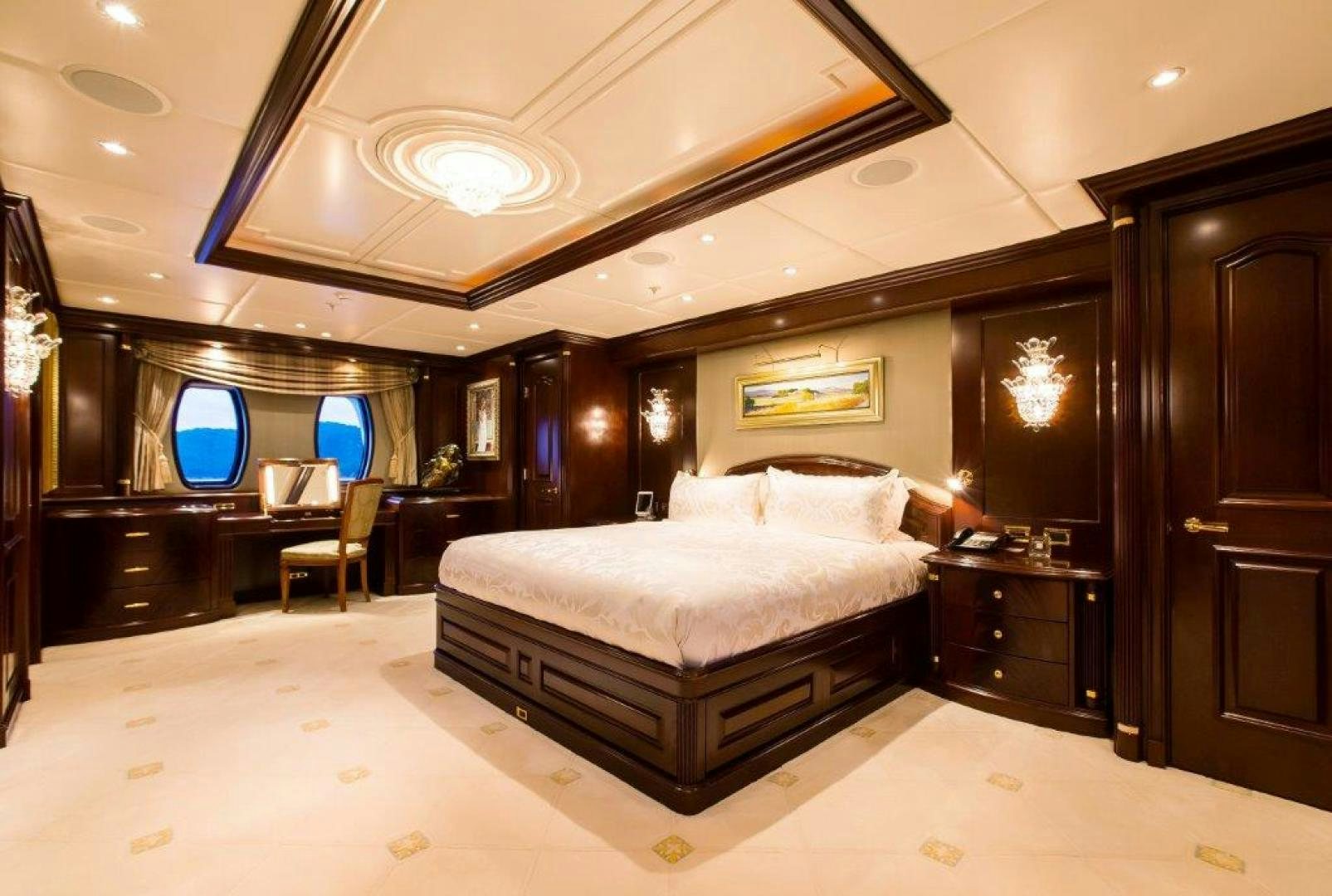 a large bedroom with a large bed aboard MUSTIQUE Yacht for Sale