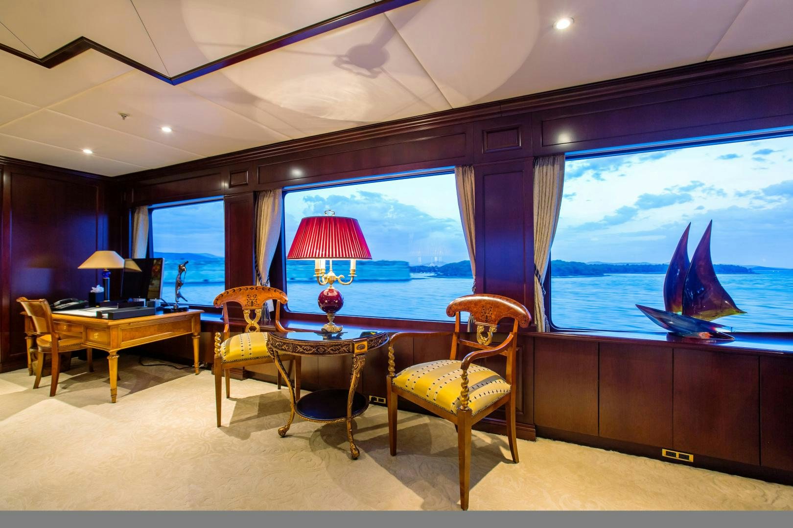 a room with a table and chairs aboard MUSTIQUE Yacht for Sale