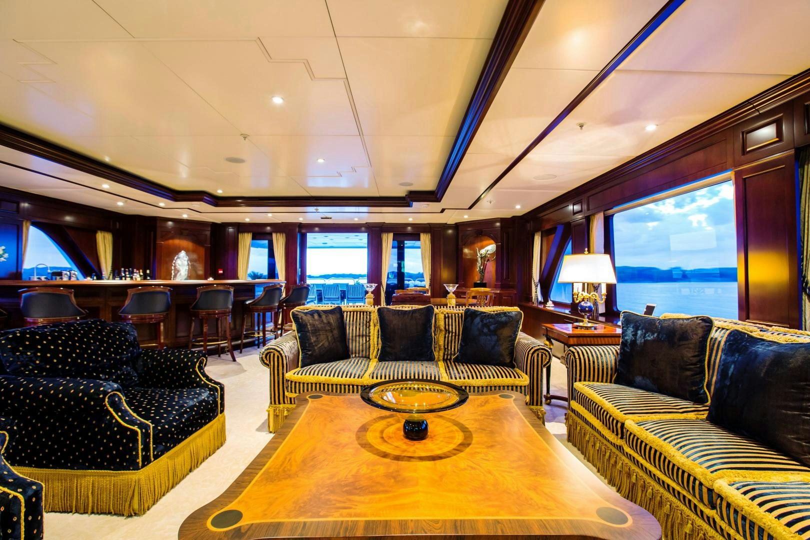 a living room with a large window aboard MUSTIQUE Yacht for Sale