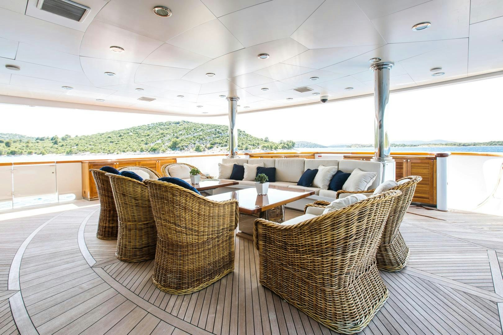a room with chairs and tables aboard MUSTIQUE Yacht for Sale