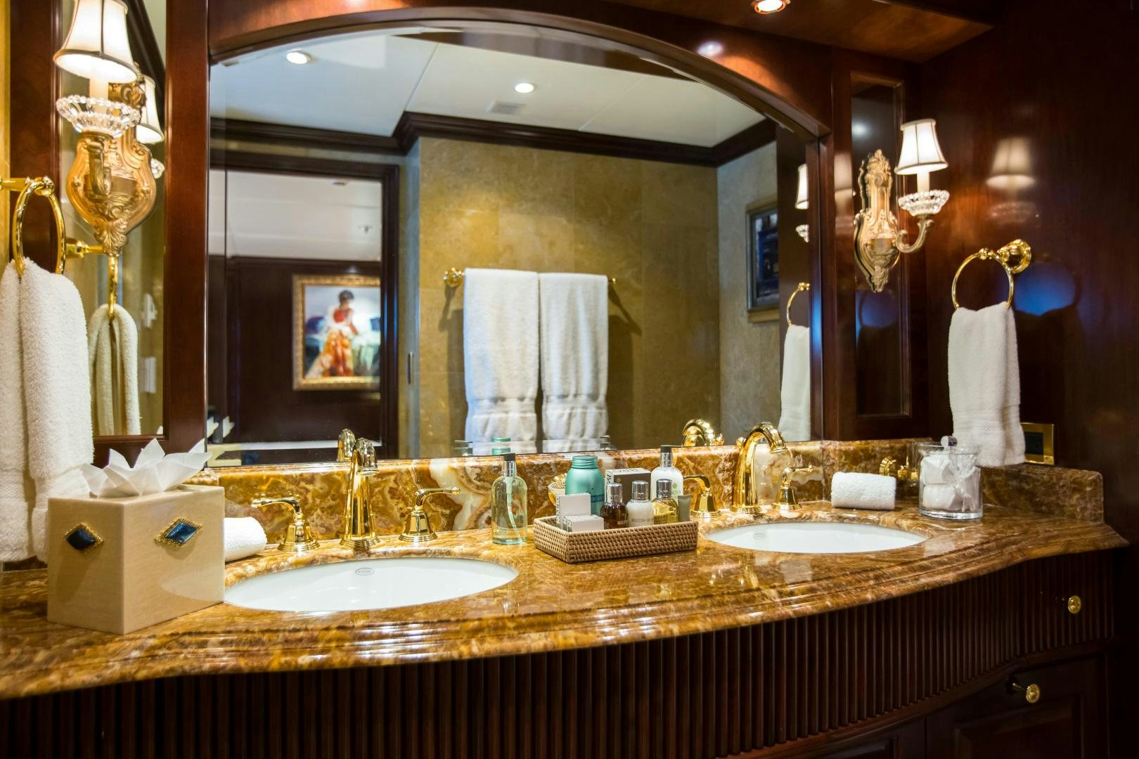 a bathroom with a large mirror aboard MUSTIQUE Yacht for Sale