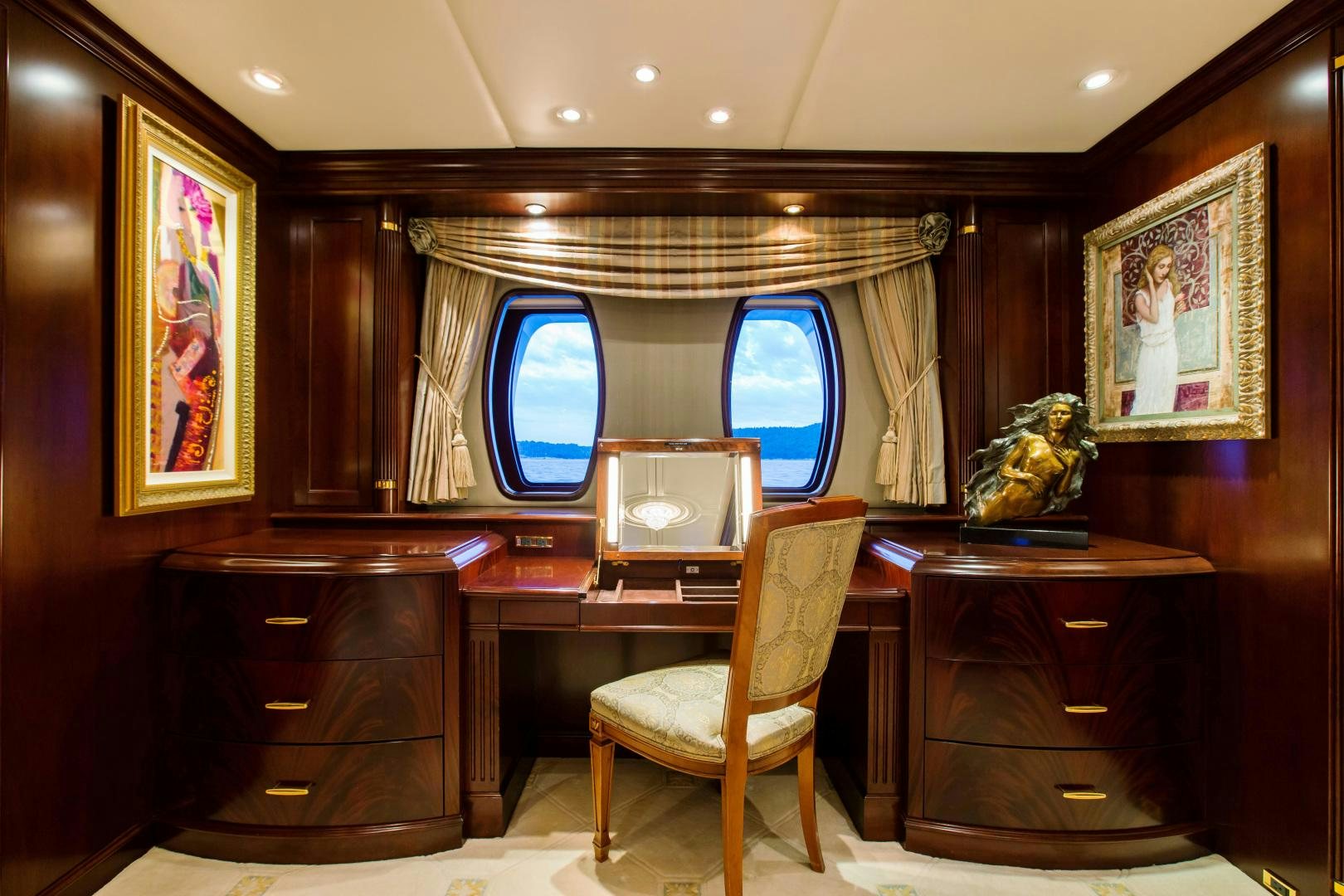 a room with a chair and a desk aboard MUSTIQUE Yacht for Sale