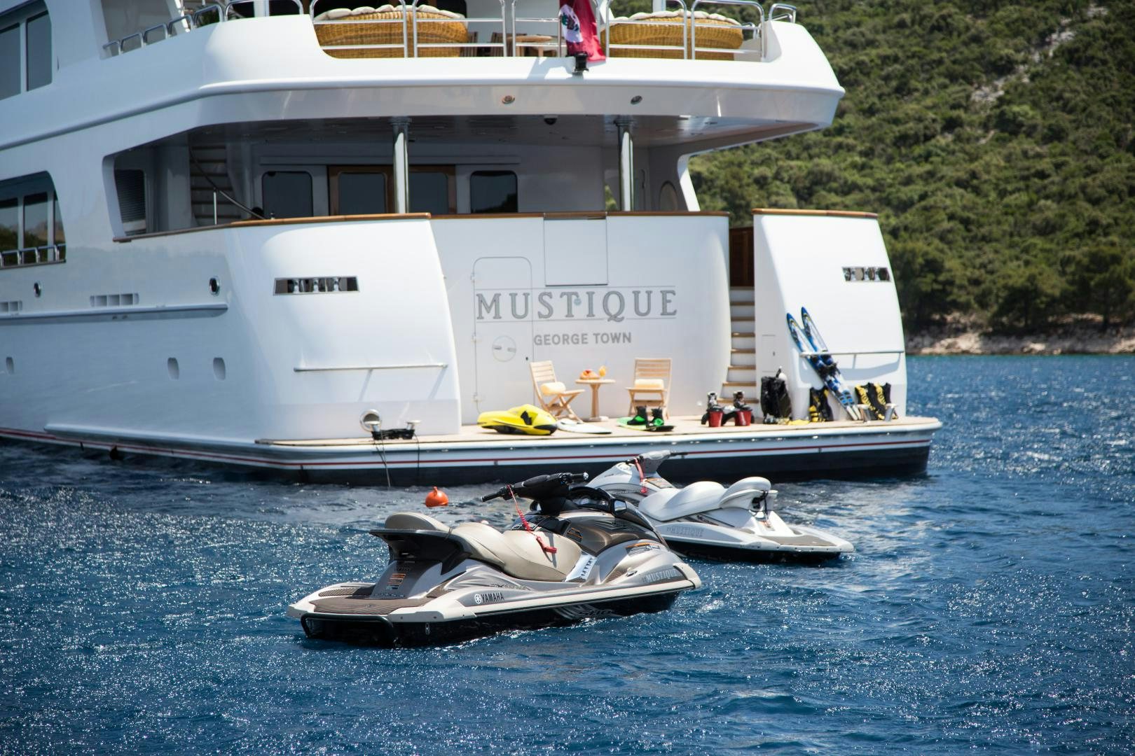 a boat on the water aboard MUSTIQUE Yacht for Sale