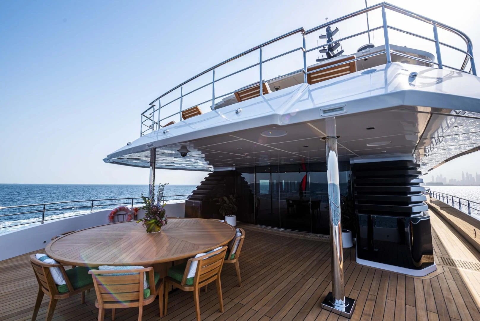 a table and chairs on a deck aboard MAJESTY 175 Yacht for Sale
