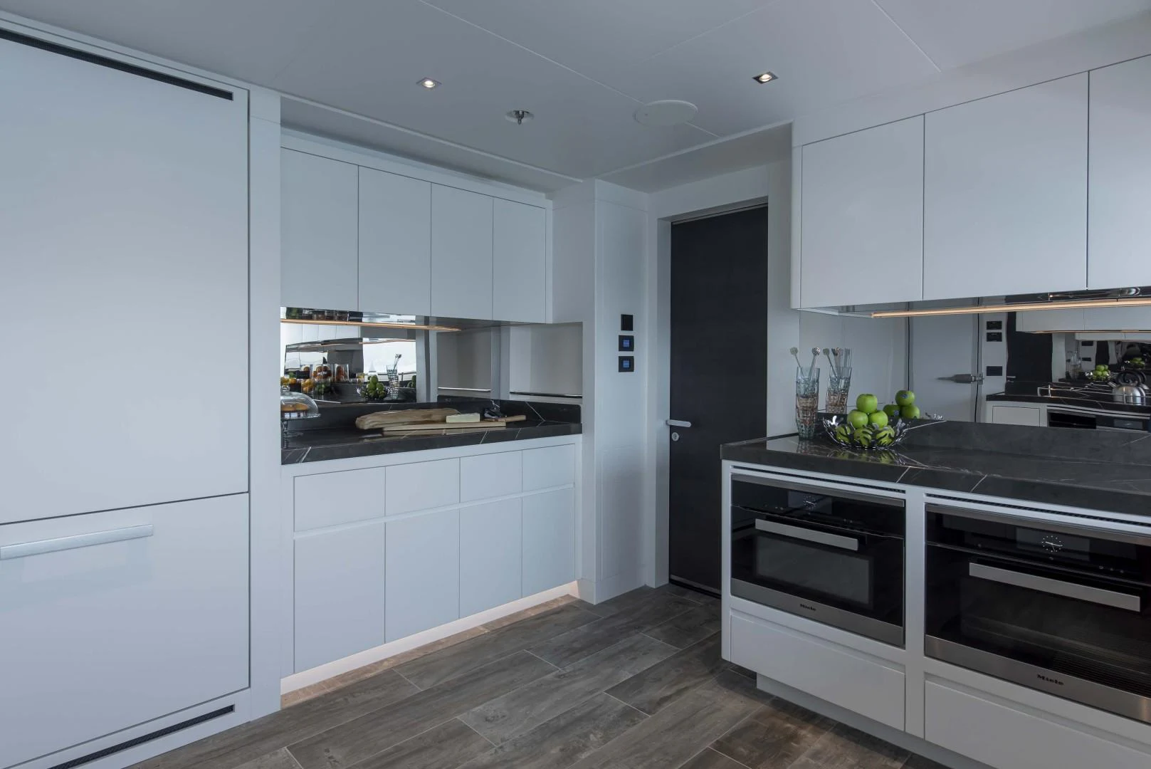 a kitchen with white cabinets aboard MAJESTY 175 Yacht for Sale