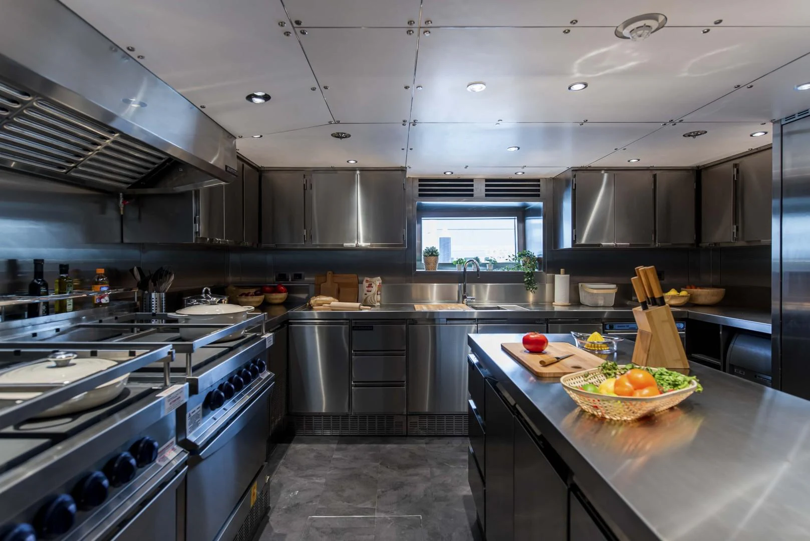 a kitchen with a large island aboard MAJESTY 175 Yacht for Sale