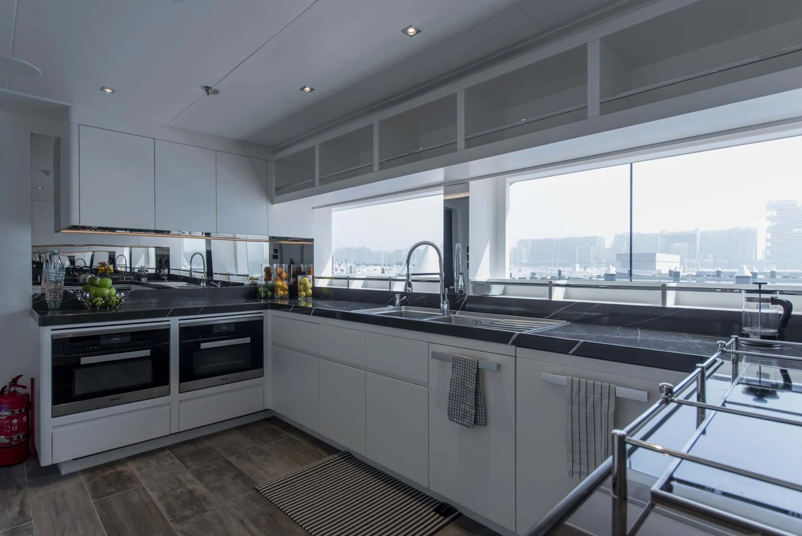 a kitchen with white cabinets aboard MAJESTY 175 Yacht for Sale