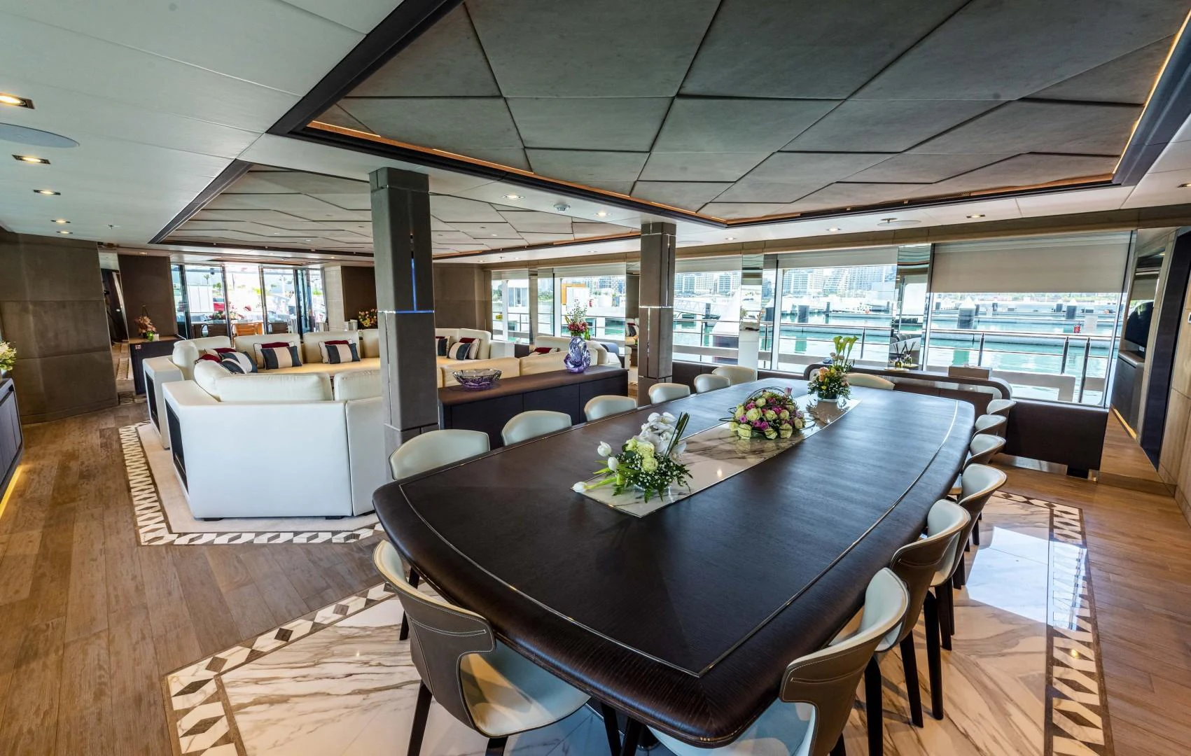 a large room with a table and chairs aboard MAJESTY 175 Yacht for Sale
