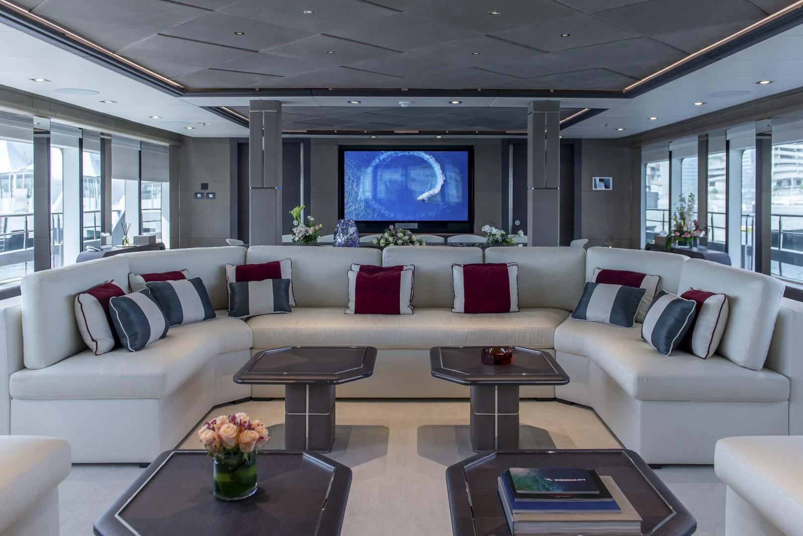 a living room with a large screen aboard MAJESTY 175 Yacht for Sale