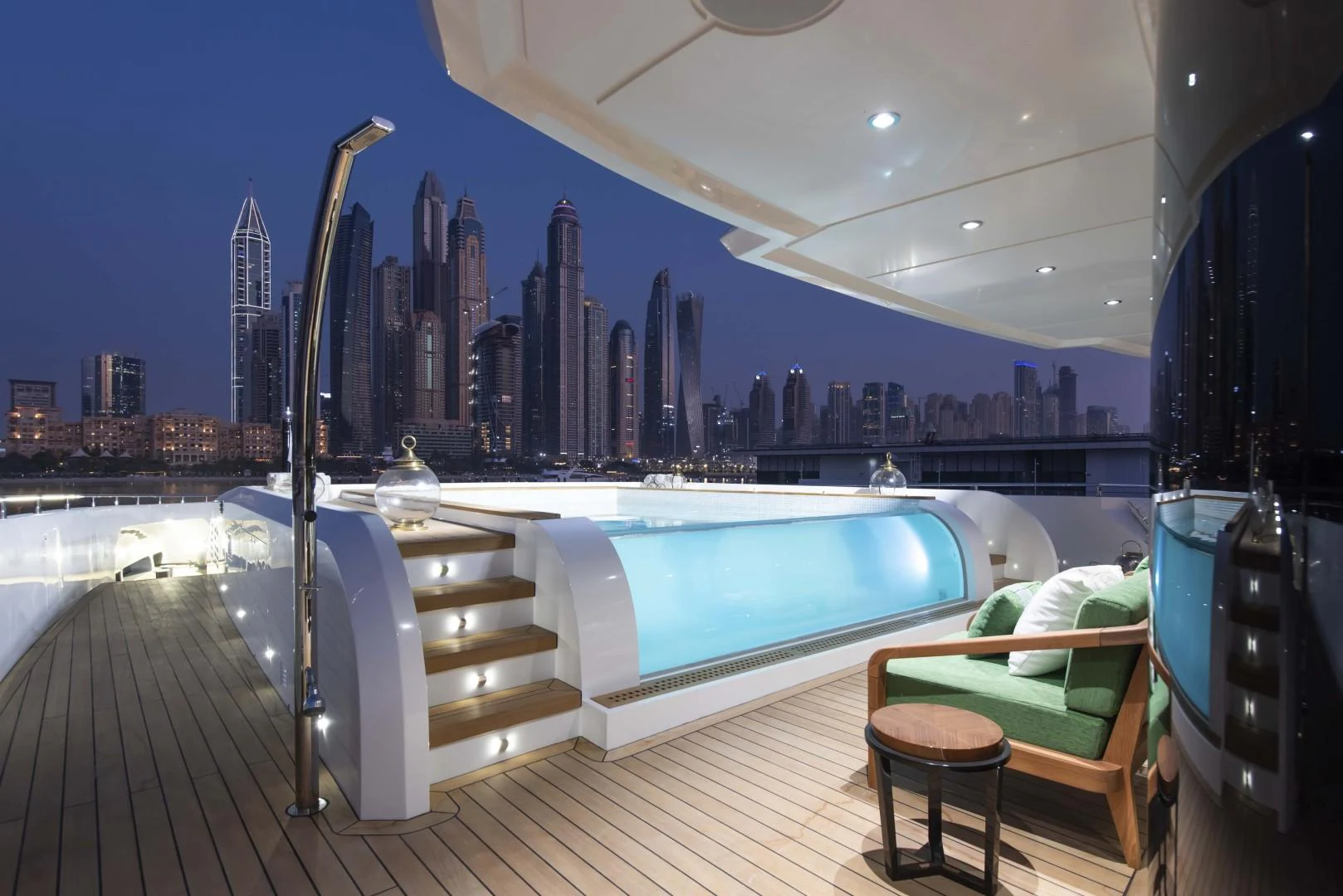 a large city skyline seen from a balcony of a pool aboard MAJESTY 175 Yacht for Sale