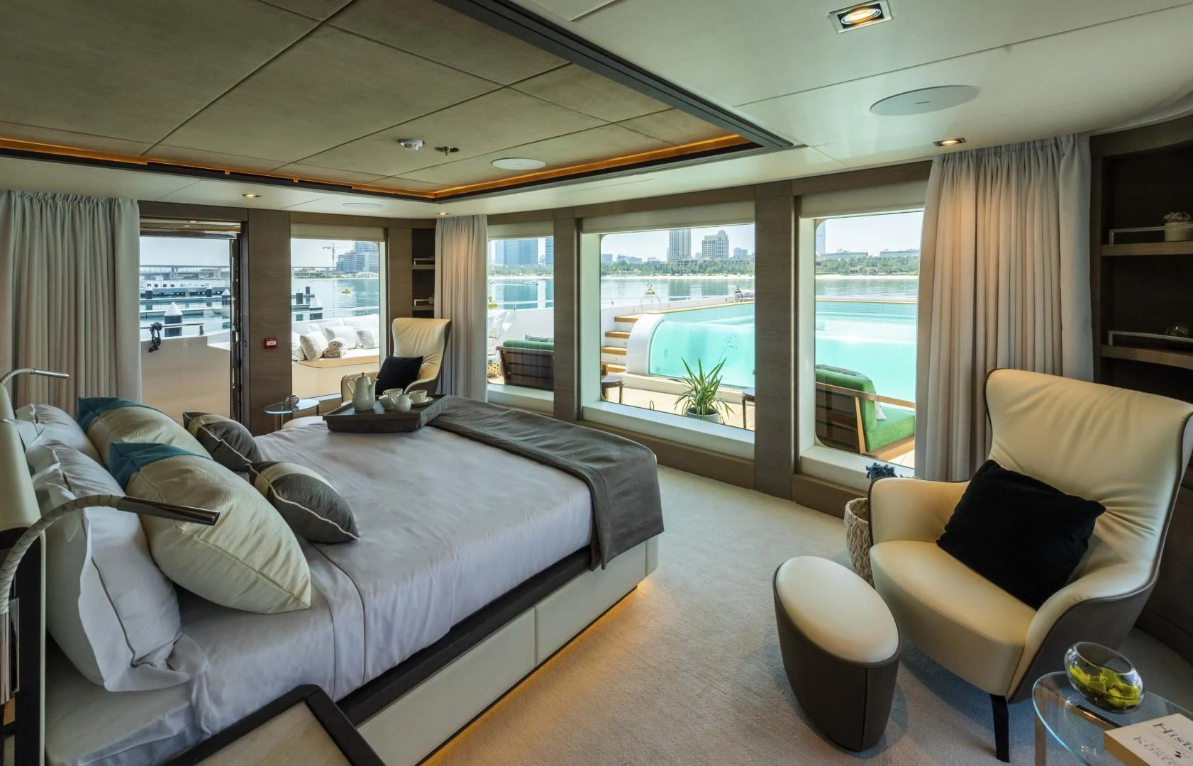 a room with a bed and a chair aboard MAJESTY 175 Yacht for Sale