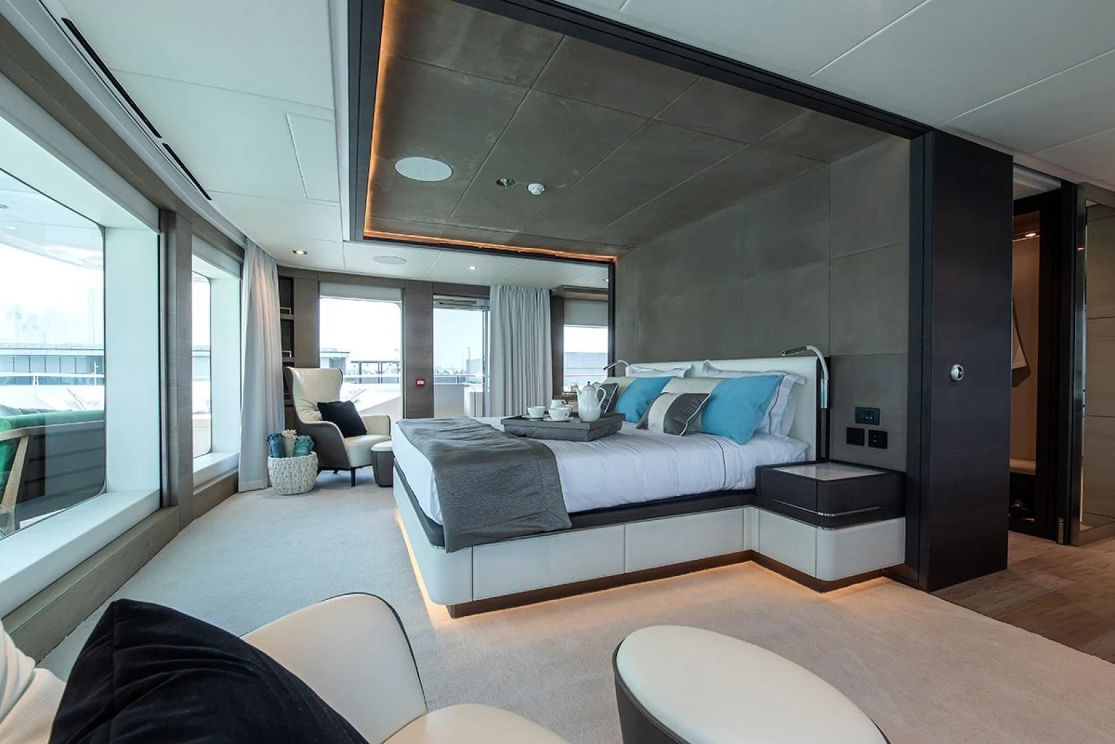 a room with a bed and a chair aboard MAJESTY 175 Yacht for Sale