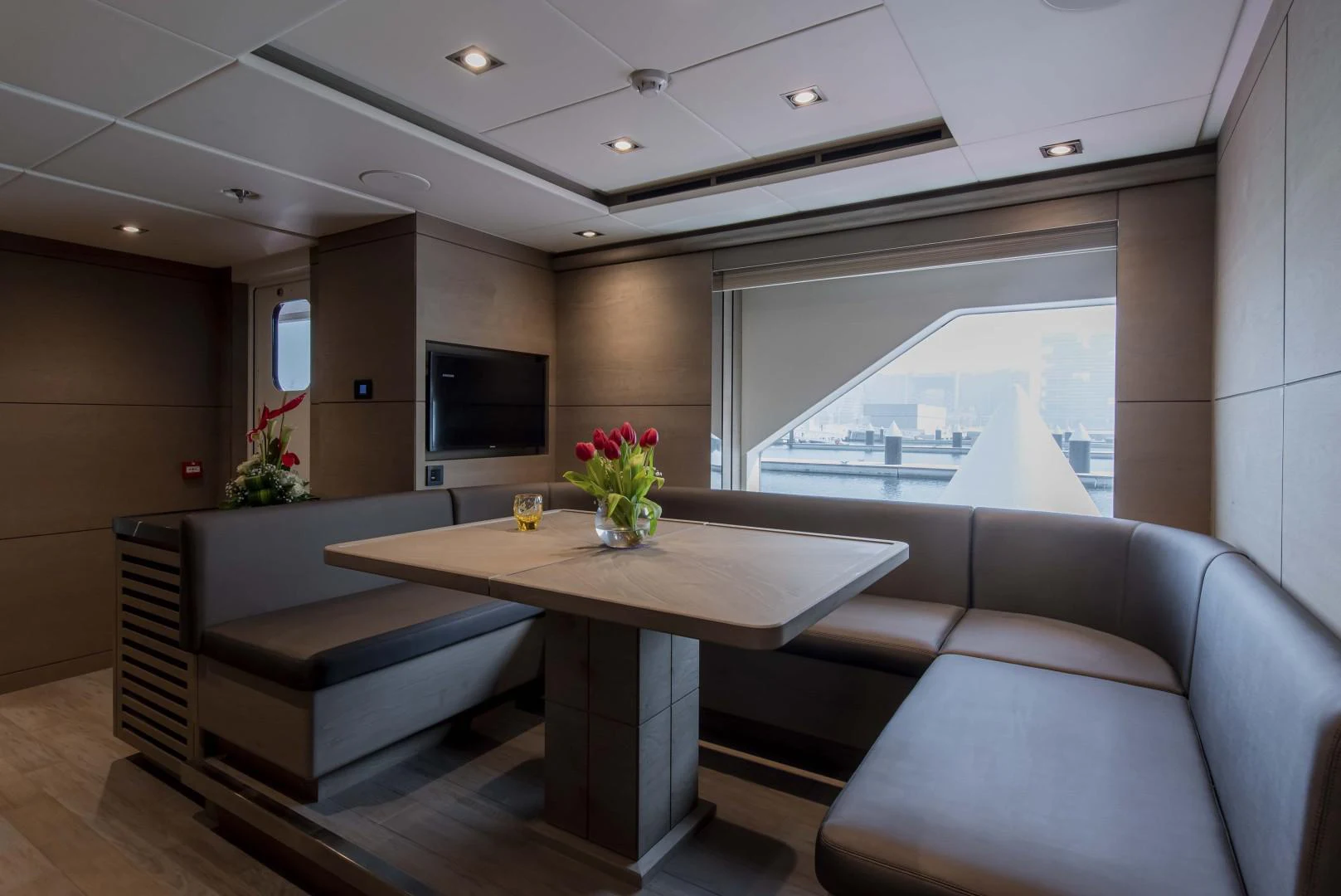 a living room with a table and couches aboard MAJESTY 175 Yacht for Sale