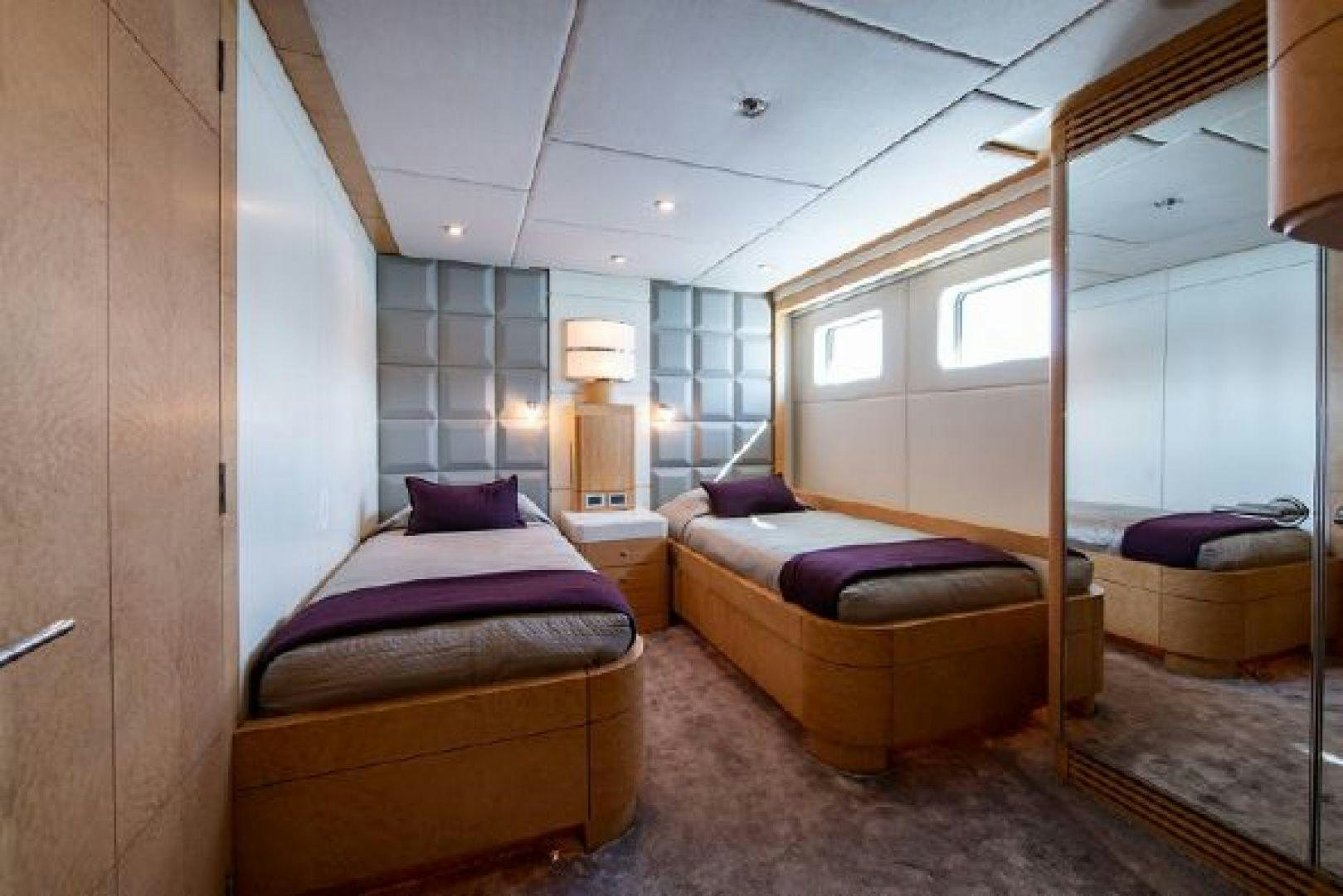 a bedroom with a bed and a couch aboard 174 OCEANFAST MIZU Yacht for Sale