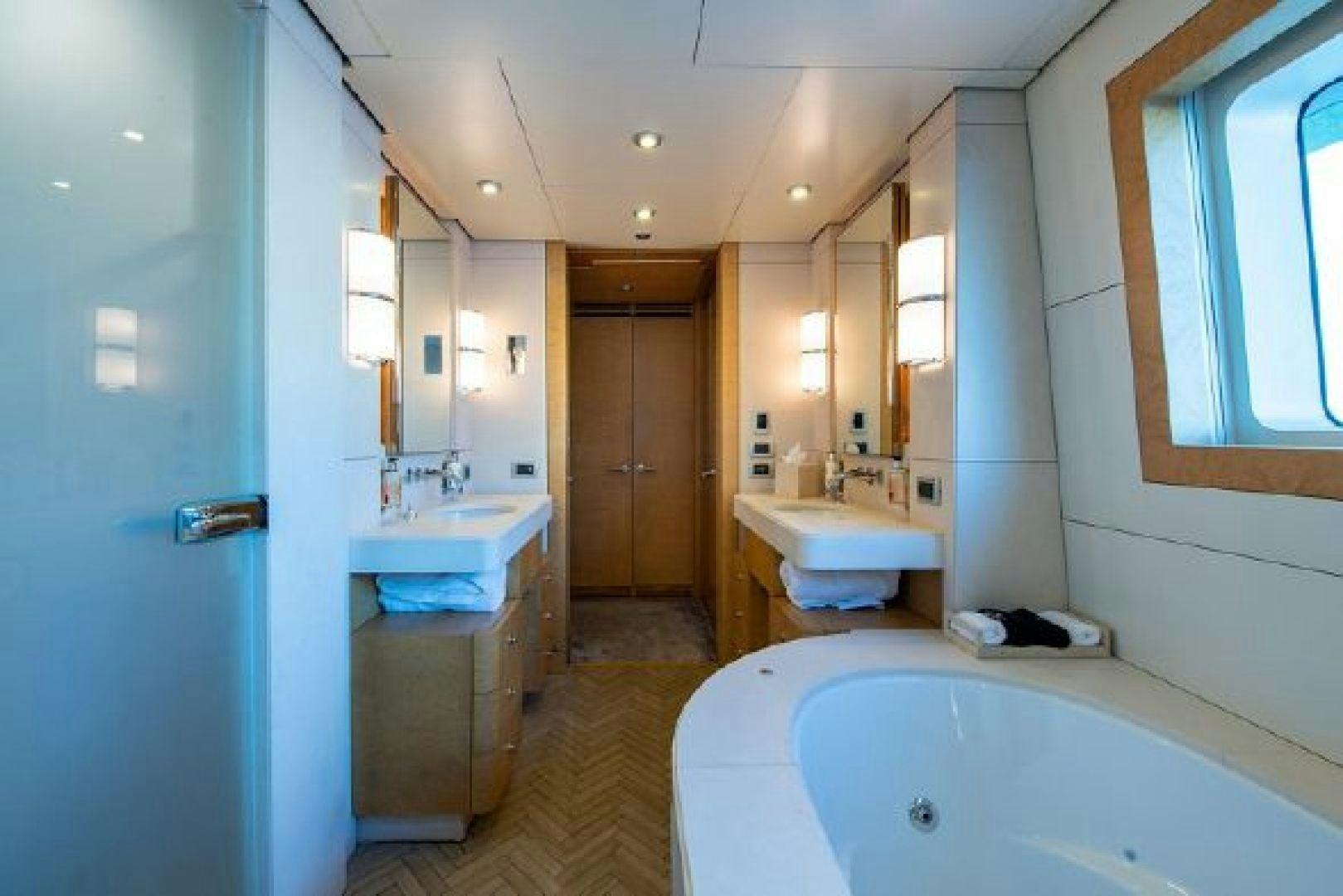 a bathroom with a tub sink and a sink aboard 174 OCEANFAST MIZU Yacht for Sale