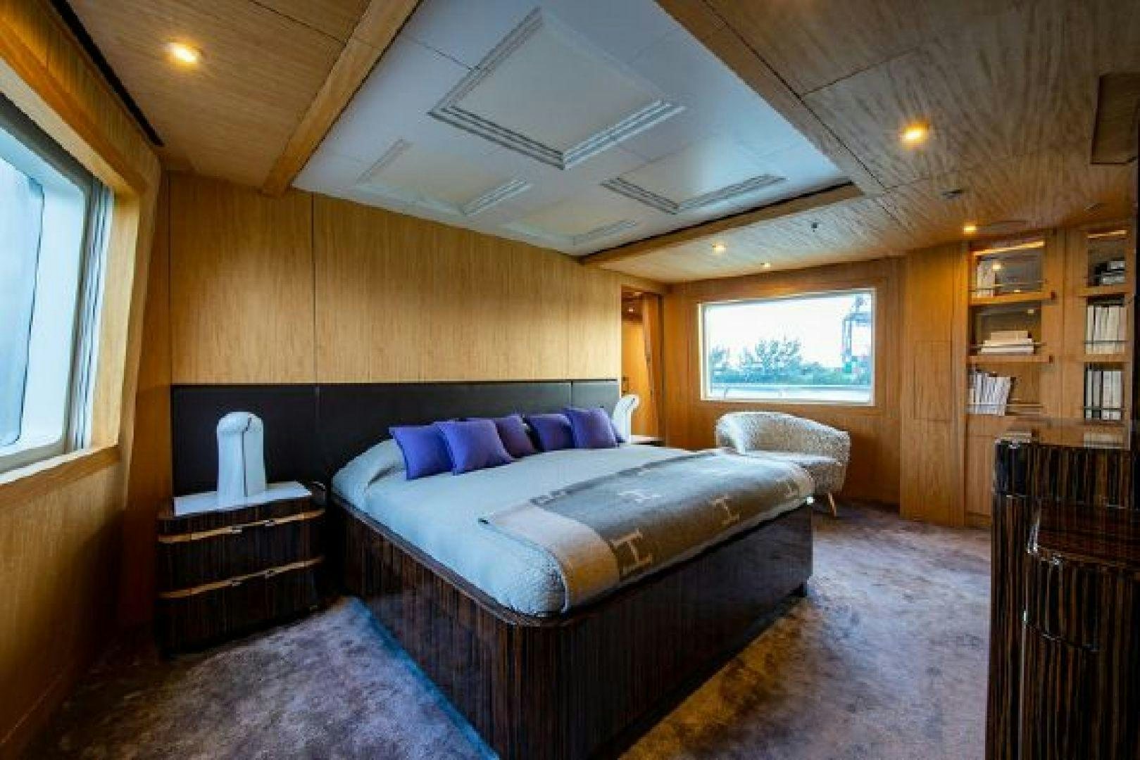 a bedroom with a bed and a window aboard 174 OCEANFAST MIZU Yacht for Sale