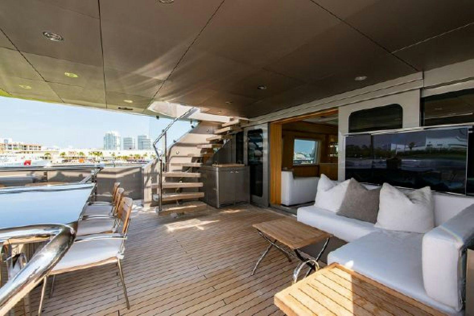a living room with a large balcony aboard 174 OCEANFAST MIZU Yacht for Sale