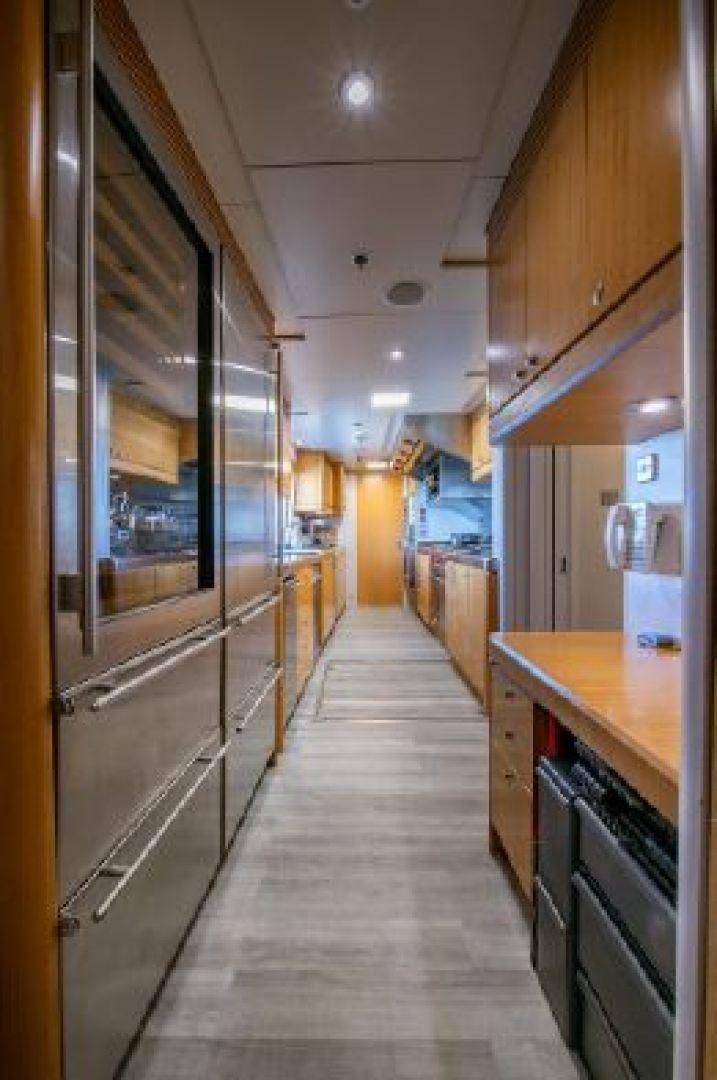 a long hallway with a glass door aboard 174 OCEANFAST MIZU Yacht for Sale