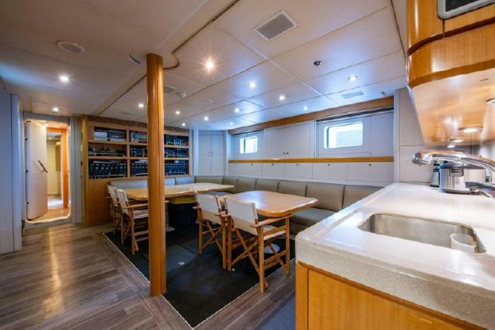 a kitchen with a table and chairs aboard 174 OCEANFAST MIZU Yacht for Sale