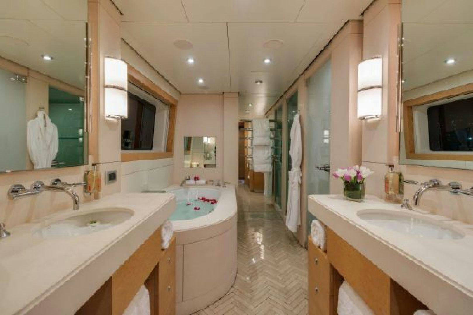 a bathroom with two sinks and a large mirror aboard 174 OCEANFAST MIZU Yacht for Sale
