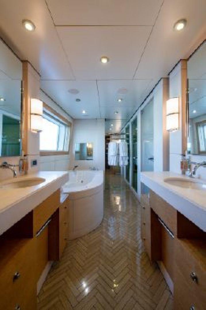 a bathroom with a tub sink and sinks aboard 174 OCEANFAST MIZU Yacht for Sale