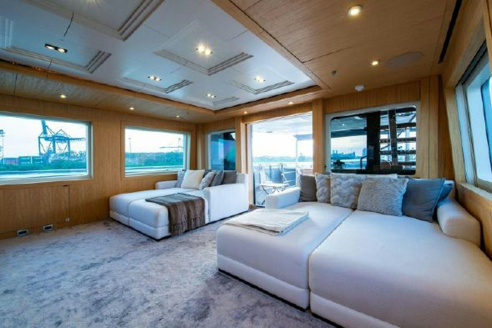 a living room with a large window aboard 174 OCEANFAST MIZU Yacht for Sale