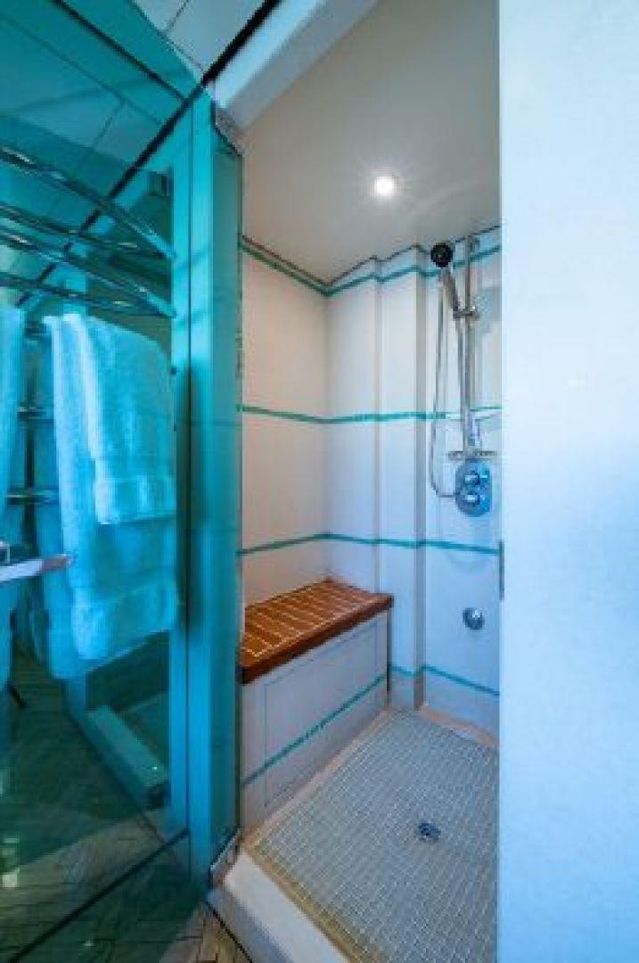 a bathroom with a shower and a sink aboard 174 OCEANFAST MIZU Yacht for Sale