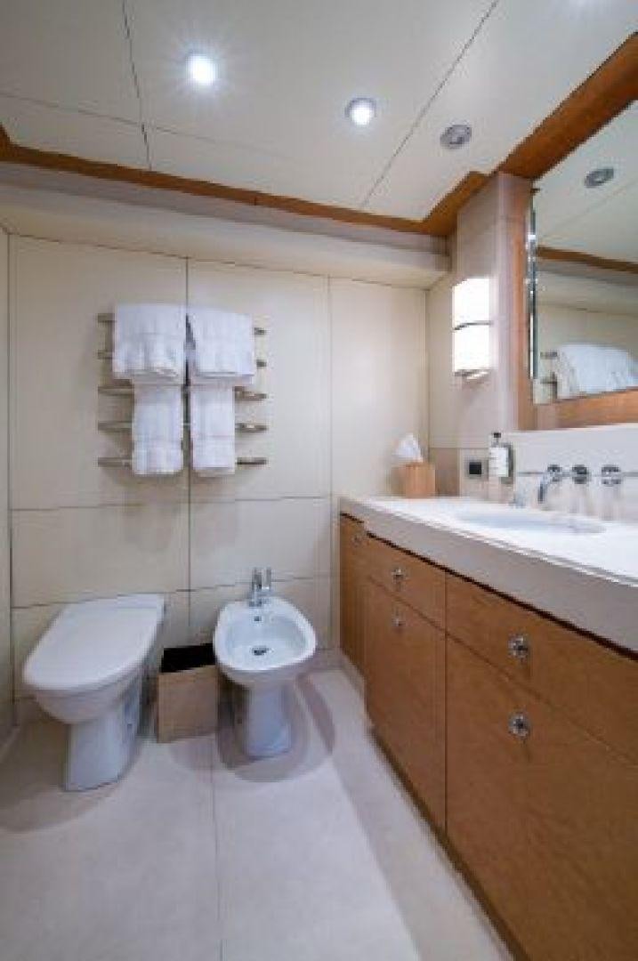 a bathroom with a toilet and a sink aboard 174 OCEANFAST MIZU Yacht for Sale