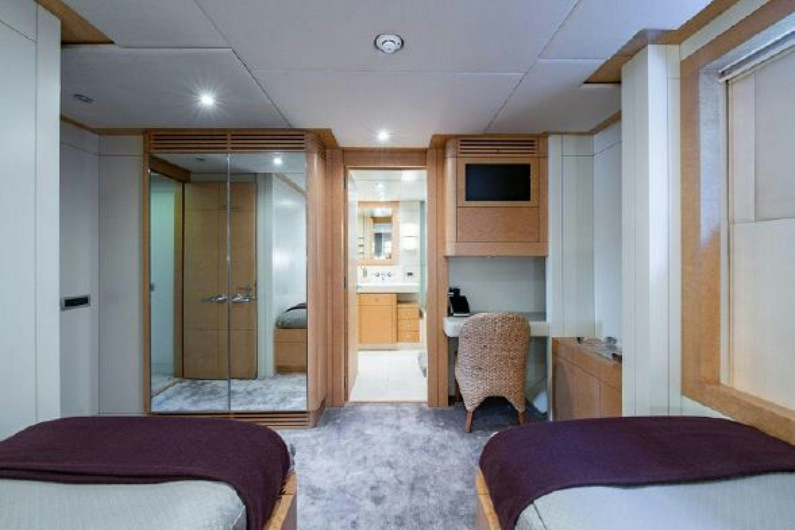 a bedroom with a bed and a door aboard 174 OCEANFAST MIZU Yacht for Sale