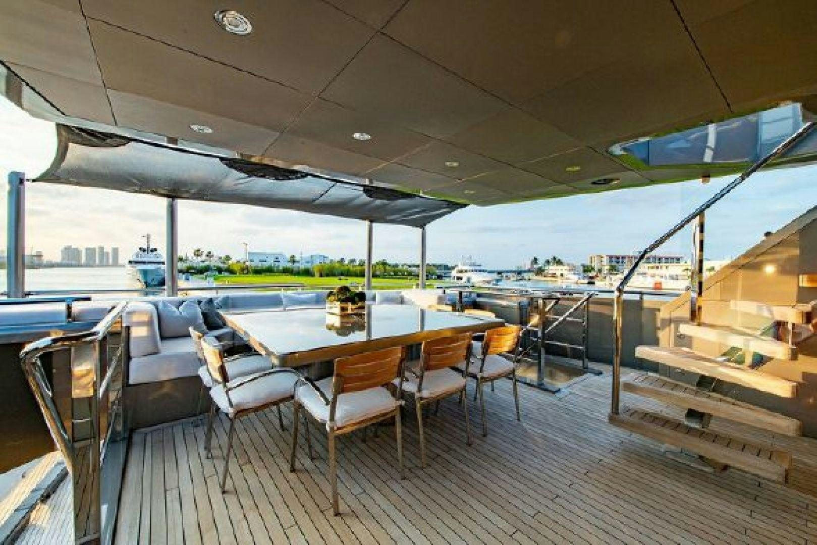 a room with a table and chairs aboard 174 OCEANFAST MIZU Yacht for Sale